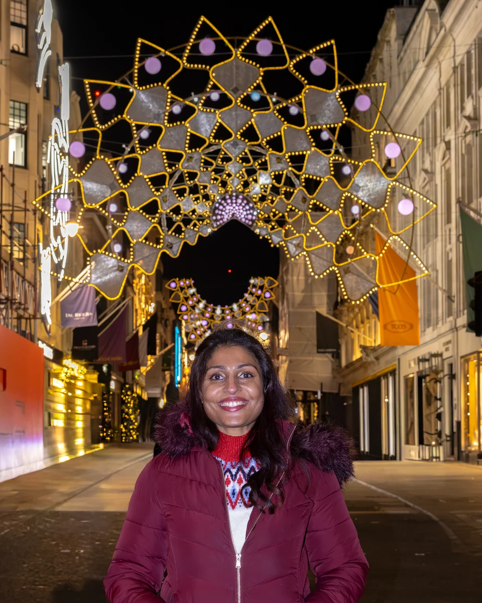 Illuminated stars suspended along Piccadilly Arcade.
