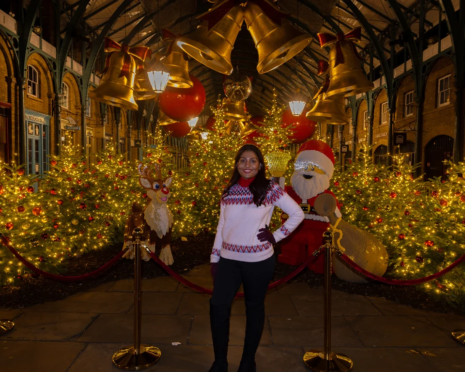 Matty beneath golden-leaf Christmas decorations in Covent Garden.